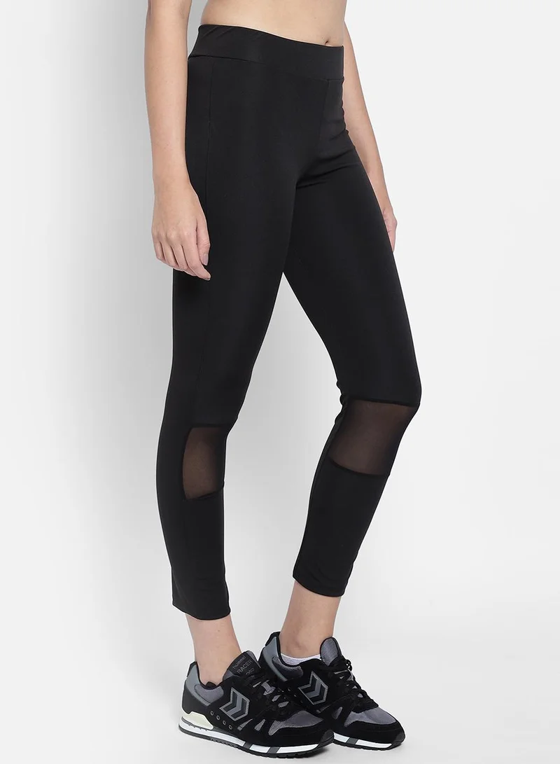 Clovia Black Snug Fit Active Tights in Black with Reflective Logo for Women | Best Price UAE